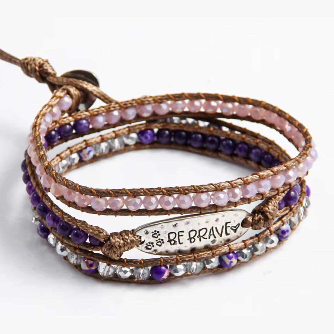 Multistrand beaded bracelet with 'BE BRAVE' charm on a white background