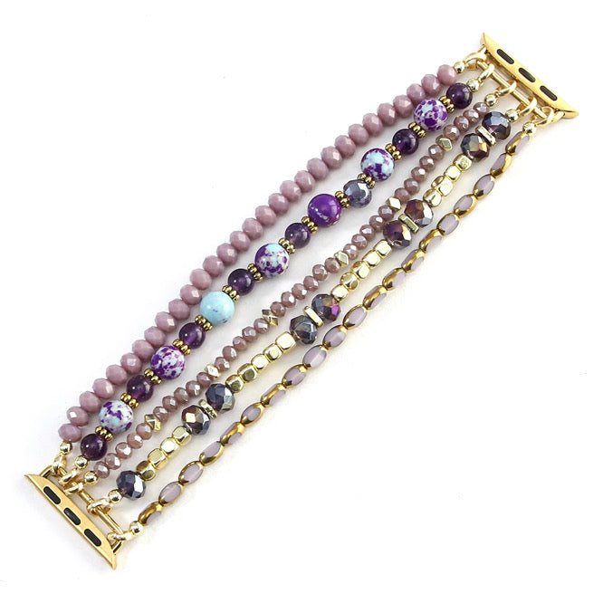 Set of beaded bracelets with gold accents on a white background