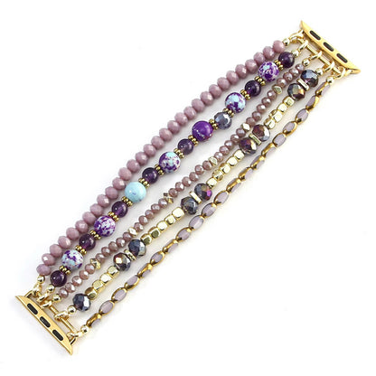 Set of beaded bracelets with gold accents on a white background