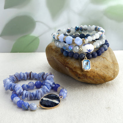 Set of blue beaded bracelets on a stone with a natural background
