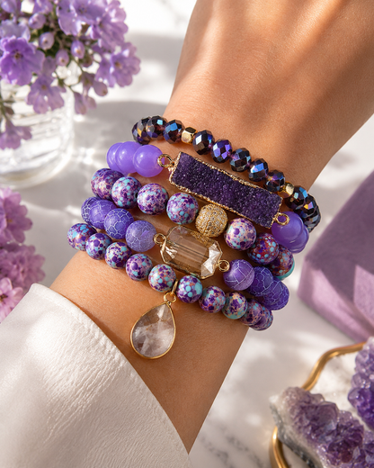Purple bracelet stack on models wrist 